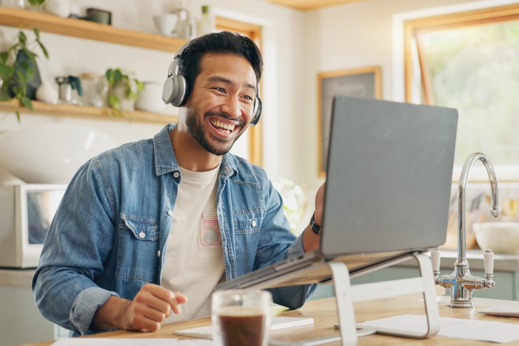 Remote work from home, talking and man with a laptop, video call or social media with online meetin.